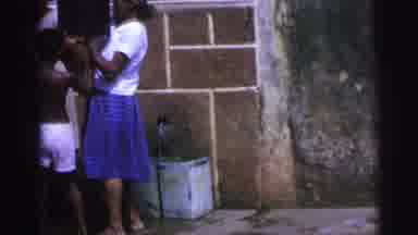 Brazil (1967): Woman Lifts Heavy Box On Child's Head Before He Carries It Away