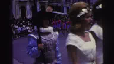 Brazil (1967): People Dressed In Costume And Equipped With Props Walk The Street