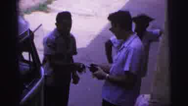 Brazil (1967): Men Exchanging Money Near Vehicle Cigarette Sunglasses Three Papers