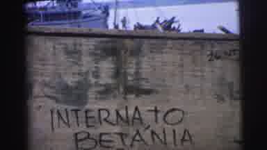 Brazil (1967): Writing Words On A Wall While A Fishing Boat Floats By