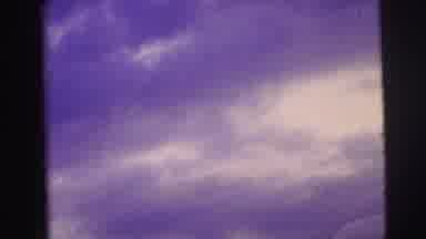 Brazil (1967): A Hand Turns A Page Over To Reveal Clouds In A Sky