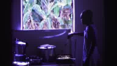Brazil (1967): Woman Wearing An Apron Cooking Potatoes On A Pan In A Dark Room On