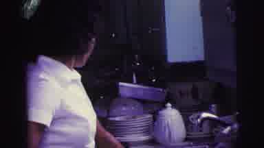 Brazil (1967): Woman Working At A Kitchen Sink Next To A Pile Of Dishes Cuts To