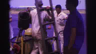 Brazil (1967): One Man Carries A Ladder While The Other Wheels Over A Heavy Piece