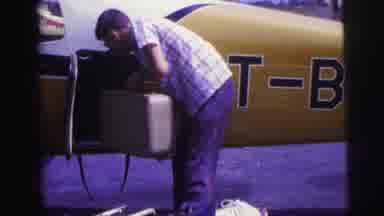 Brazil (1967): Man Putting Suitcase Into Small Airplane