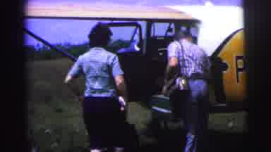 Brazil (1967): A Passenger Carries Luggage To A Shelter Followed By A Man Removing