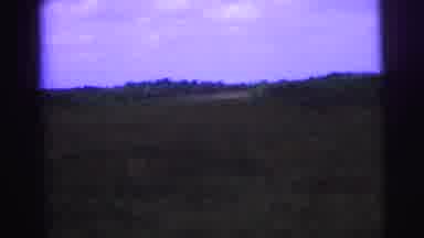 Brazil (1967): A Jeep Travels Down A Dirt Road Toward A Yellow Plane