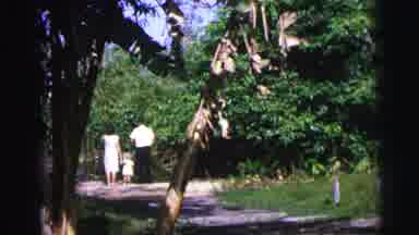 Brazil (1967): A Man In A Red Tie Walking Away From A Woman And A Child