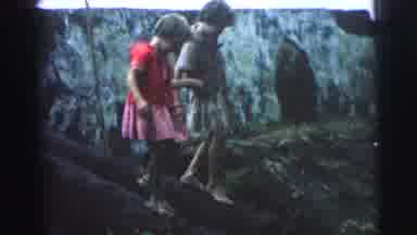 Brazil (1967): A Boy And A Girl Walking Down Logs In The Forest