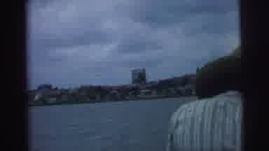 Brazil (1967): A Person Standing With A Body Of Water In The Background And Land
