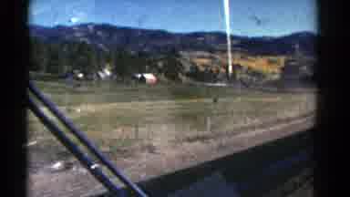 Colorado US-1967: A Tractor Moving Freely On The Country Rode Along The Side Of