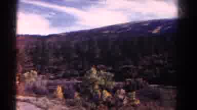 Colorado US (1967): Airplane Flying Among The Mountains