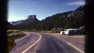 Colorado US (1967): A Bus Driver Standing On The Outside Of The Bus And A Cut To