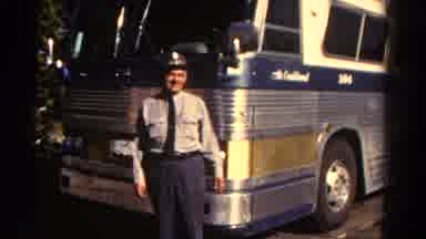Colorado US (1967): Male Bus Driver Poses In Front Of Large Steel Bus Before His