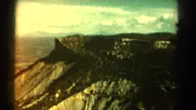 Colorado US (1967): An Airplane Riding Over Mountains And Mountain Peaks