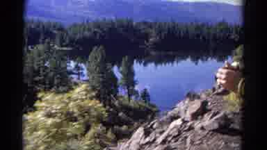 Colorado USA (1967): A Lake With Pine Trees In The Mountains
