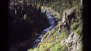 Colorado USA (1967): Flowing Water Between Two Beautiful Mountain Ranges Full Of
