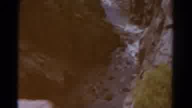 Colorado USA (1967): At The Edge Of A Mountain Showing Rocks And Green Grass And A