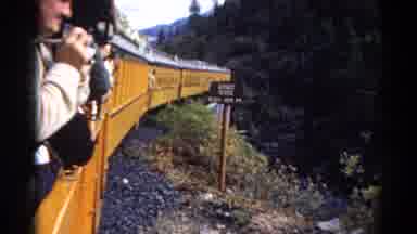 Colorado USA (1967): People Leaning Out Of Moving Yellow Train