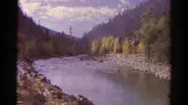 Colorado USA (1967): View Of River Surrounded By Forested Mountains Seen From