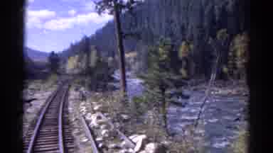 Colorado USA (1967): The Train Is Moving Slow With The Y'all Tree And The Water