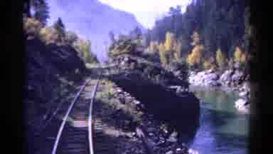 Colorado USA (1967): The View From The Back Of A Train Along A Riverside Track