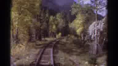 Colorado USA (1967): Railway Track Near The Mountains Passing From River And Trees
