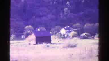 Colorado USA (1967): Old Footage Of A Two Story Building In A Field Near A White