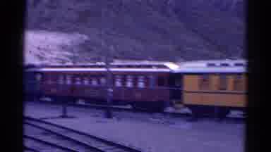 Colorado USA (1967): Pulling Into A Train Yard With Trains Full Of People Many