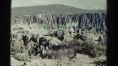 Colorado USA (1967): A Double Exposure Of Something Over A Desert Canyon With
