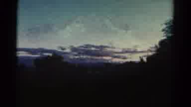 Colorado USA (1967): Sky With Many Rain-Laden Clouds In The Background Of Trees
