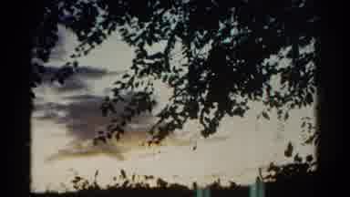 Colorado USA (1967): Rain Laden Clouds In The Background Of Green Trees And