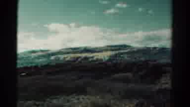 Colorado USA (1967): Mountains In Horizon With Trees In Front And A Plane With