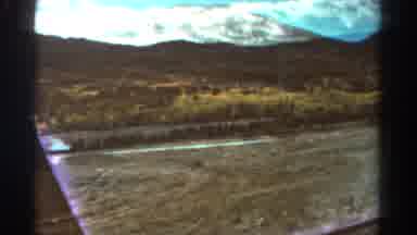 Colorado USA (1967): Person Driving In Car Past The Desert