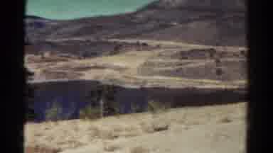Colorado USA (1967): Lake In A Dry Landscape With Boy Standing Next To It