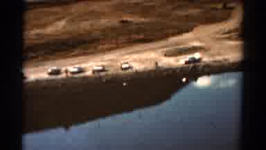 Colorado USA (1967): Helicopter Tracking Shot Of Cars Parked By Lake With