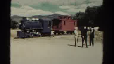 Colorado USA (1967): Three People Standing Outside Of An Old Steam Roller Talking