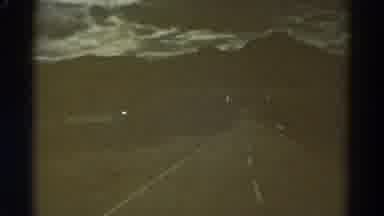 Colorado USA (1967): Leaving A City By The Road At Dusk Full Of Lightning And