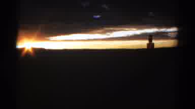 Colorado USA (1967): The Sun Sets Showing A Statue In The Distance As The Sky