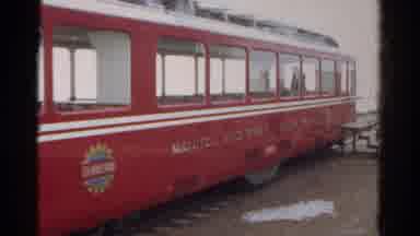 Colorado USA (1967): Red Train Sits At Station On Tracks While Passengers Get On