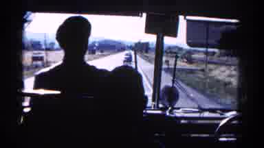 Colorado USA (1967): View Behind The Bus Driver As He Drives Down The Highway