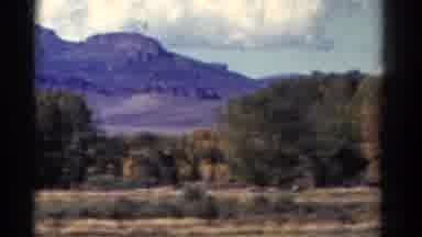 Colorado USA (1967): A Vehicle Driving Down A Road With A Beautiful View Of The