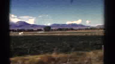 Colorado USA (1967): Rolling Plains Farmland Countryside Snow Capped Peaks Driving