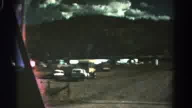 Colorado USA (1967): Driving Past A Valley By A Mountain With Cars And Campers