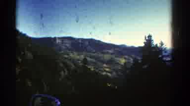 Colorado USA (1967): Car Driving Along Cliff Recording Mountain Close Up