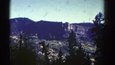 Colorado USA (1967): A Scene Of The Large Sky Mountains And Trees Outside