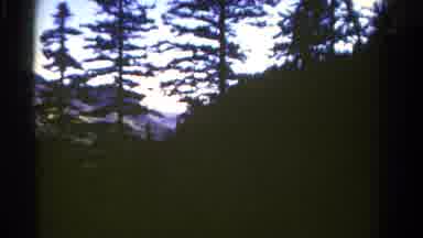 Colorado USA (1967): Driving Down A Mountainous Highway During The Day Showing The
