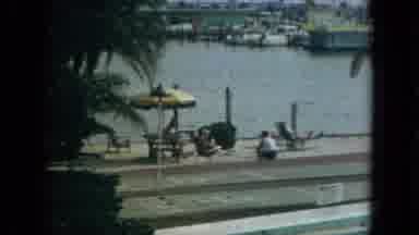 Florida (1967): People On Vacation Relaxing In Front Of Body Of Water It Looks