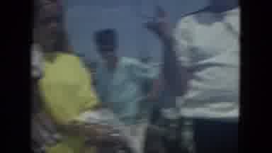 Florida (1967): A Man Holds A Stringer Full Of Fish Near Two Young Women Followed