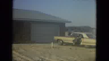 Florida (1967): Gold Car Sitting In Front Of A Brick Home Camera Is Scanning Over